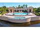 Stunning pool area with spa, seating, and elegant architecture overlooking a waterway at 15 Jefferson S Ct, St Petersburg, FL 33711