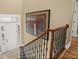 A view of the staircase with decorative railing and art, leading to the upper level at 15 Jefferson S Ct, St Petersburg, FL 33711
