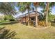 Enjoy the screened-in lanai with a private pool, surrounded by tropical landscaping in the backyard at 16410 Ivy Lake Dr, Odessa, FL 33556