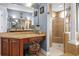 Well-lit bathroom with a vanity area, walk-in shower, and lots of counter and storage space at 16410 Ivy Lake Dr, Odessa, FL 33556
