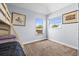 Bright bedroom with neutral walls, two windows, and wall art at 16410 Ivy Lake Dr, Odessa, FL 33556
