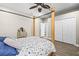 Bedroom featuring ceiling fan, wood floors, and double door closet at 16410 Ivy Lake Dr, Odessa, FL 33556