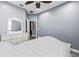 Bedroom featuring carpet, white trim, and a view to the hall at 16410 Ivy Lake Dr, Odessa, FL 33556