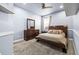Cozy bedroom with carpet, dresser, mirror, and a comfortable queen size bed at 16410 Ivy Lake Dr, Odessa, FL 33556