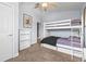 Bedroom with bunk beds, ceiling fan, and natural light at 16410 Ivy Lake Dr, Odessa, FL 33556