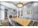 Refined dining area with gray upholstered chairs, a marble table top, and ample space for entertaining guests at 16410 Ivy Lake Dr, Odessa, FL 33556