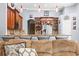 Spacious kitchen featuring granite countertops, stainless appliances, and breakfast bar seating at 16410 Ivy Lake Dr, Odessa, FL 33556