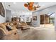 Living room with open access to kitchen, dining area and outdoor living at 16410 Ivy Lake Dr, Odessa, FL 33556