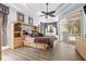 Spacious main bedroom with a ceiling fan, built-in storage, and access to the pool area at 16410 Ivy Lake Dr, Odessa, FL 33556