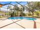 Relaxing view of the pool and landscaping at 16410 Ivy Lake Dr, Odessa, FL 33556
