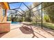 Poolside view of a covered patio at 16410 Ivy Lake Dr, Odessa, FL 33556