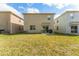 Fenced-in backyard, perfect for entertaining, features a patio with a grill and seating area at 16549 Secret Meadow Dr, Odessa, FL 33556