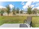 View of the backyard featuring a well-maintained lawn and privacy fence at 16549 Secret Meadow Dr, Odessa, FL 33556