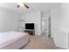 Bedroom with ceiling fan and TV area at 16549 Secret Meadow Dr, Odessa, FL 33556