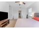 Bedroom with TV and walk-in closet at 16549 Secret Meadow Dr, Odessa, FL 33556