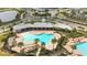 A great shot of the community pool with an elegant design, plenty of lounge space, and convenient access at 16549 Secret Meadow Dr, Odessa, FL 33556