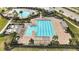 A clear shot of the community pool featuring multiple swimming lanes, lounge areas, and ample deck space at 16549 Secret Meadow Dr, Odessa, FL 33556