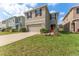Two story home featuring a two car garage, neutral toned stucco, well-kept lawn and landscaping at 16549 Secret Meadow Dr, Odessa, FL 33556