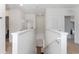Upstairs hallway with neutral paint and lighting at 16549 Secret Meadow Dr, Odessa, FL 33556