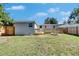 Back exterior view of the home with a deck and a fire pit at 1940 N Betty Ln, Clearwater, FL 33755