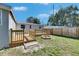 Backyard of the home featuring a wooden deck and firepit at 1940 N Betty Ln, Clearwater, FL 33755