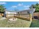 Picture of the wooden decks and fire pit in the backyard at 1940 N Betty Ln, Clearwater, FL 33755
