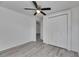 Bedroom featuring closet, ceiling fan, and light gray flooring at 1940 N Betty Ln, Clearwater, FL 33755