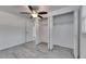 Bedroom featuring closet with folding doors, ceiling fan, and light gray flooring at 1940 N Betty Ln, Clearwater, FL 33755