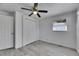 Bedroom with closet, ceiling fan, light gray flooring and a window at 1940 N Betty Ln, Clearwater, FL 33755
