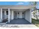 Spacious covered porch, offering ample room for outdoor activities and parking, for residents and guests at 1940 N Betty Ln, Clearwater, FL 33755
