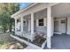Charming covered front porch, perfect for enjoying the outdoors while being sheltered from the elements at 1940 N Betty Ln, Clearwater, FL 33755