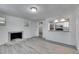 Open concept living area with gray flooring and view of modern kitchen at 1940 N Betty Ln, Clearwater, FL 33755