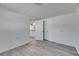 Spacious room features wood-look floors with easy access to other parts of the home at 1940 N Betty Ln, Clearwater, FL 33755