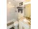 Renovated bathroom featuring a glass shower, granite countertop, and modern fixtures at 19651 Gulf Blvd # A11, Indian Shores, FL 33785