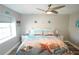 This bedroom has neutral walls, a queen sized bed with beach bedding and decor at 19651 Gulf Blvd # A11, Indian Shores, FL 33785