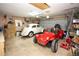 Spacious garage featuring two cars with ample storage space and high ceilings at 204 Amana Ave, Brandon, FL 33510