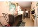 Functional laundry room with washer, dryer, cabinets, and a utility sink near a window at 204 Amana Ave, Brandon, FL 33510