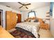 Comfortable bedroom with a wooden bed frame, matching nightstands, and ample closet space at 204 Amana Ave, Brandon, FL 33510