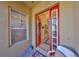 Charming entryway featuring a decorative red front door, leading into a well-lit foyer area at 2282 Sifield Greens Way # 54, Sun City Center, FL 33573