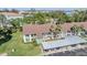 Aerial view of condo complex highlighting buildings, parking, greenery, and neighborhood amenities at 2549 Royal Pines Cir # 16H, Clearwater, FL 33763
