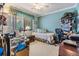 Functional room with a daybed, a computer desk, and a view through the window at 2549 Royal Pines Cir # 16H, Clearwater, FL 33763