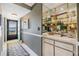 Hallway with a decorative rug, leading to the entrance door and featuring a built-in display case at 2549 Royal Pines Cir # 16H, Clearwater, FL 33763