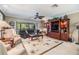 Inviting living room with a comfortable sofa, armchairs, and a decorative rug, perfect for relaxing and entertaining at 2549 Royal Pines Cir # 16H, Clearwater, FL 33763