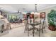 Bright and open living space with stylish furniture, including a dining table and comfortable seating area at 2549 Royal Pines Cir # 16H, Clearwater, FL 33763
