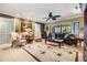 Comfortable living room with neutral tones, a plush sofa, armchairs, and a decorative rug, offering a cozy atmosphere at 2549 Royal Pines Cir # 16H, Clearwater, FL 33763