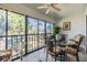 Sunroom offering views, a ceiling fan, and a table with seating for casual dining at 2549 Royal Pines Cir # 16H, Clearwater, FL 33763