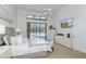 Bright main bedroom suite featuring plush carpets, a ceiling fan and sliding glass doors to the lanai at 2966 Eagle Estates W Cir, Clearwater, FL 33761