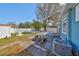 Backyard features a fence, lawn, patio, seating area, mature shade tree, and AC unit at 3127 W Lambright St # A, Tampa, FL 33614