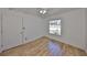 Bedroom features wood-look floors, neutral walls, and a ceiling fan with light at 3127 W Lambright St # A, Tampa, FL 33614