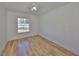 Bedroom features wood-look floors, neutral walls, and a ceiling fan with light at 3127 W Lambright St # A, Tampa, FL 33614